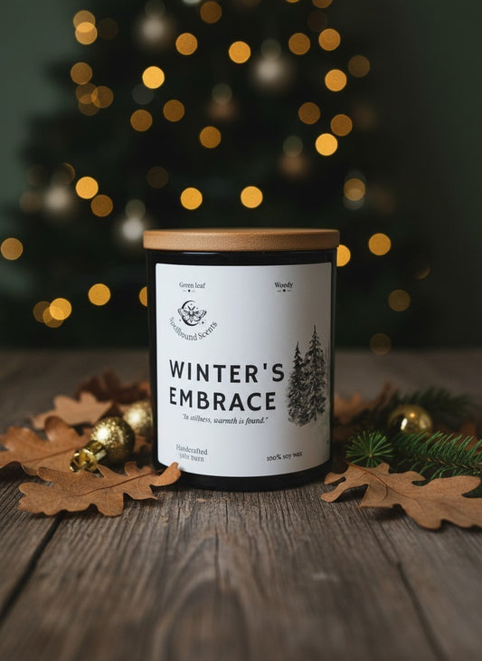 Winter’s Embrace Christmas candle by Spellbound Scents styled with winter foliage and festive decorations